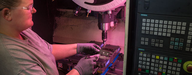 Pressed metal parts being machined