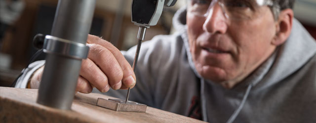 Quality control professional staff checking tolerances of a part