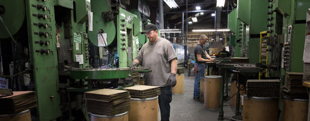 Personnel working in a compressed metals manufacturing plant