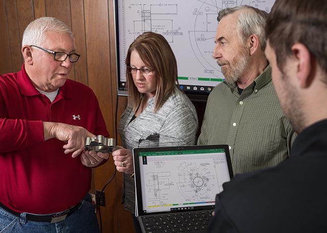 Embassy engineering staff discussing a project